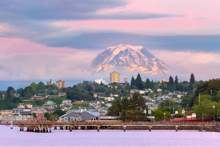 Mount Rainier over Tacoma, Washington, waterfront during alpenglow sunset evening.